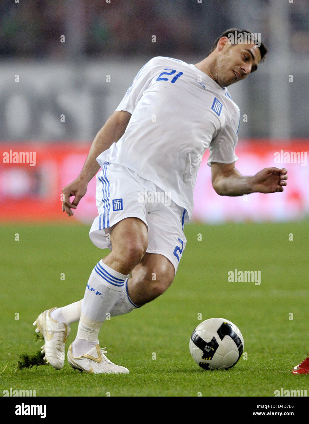 Greece's Konstantinos Katsouranis is about to chip the ball in the test cap Portugal v Greece at LTU Arena stadium in Duesseldorf, Germany, 26 March 2008. Greece defeated Portugal 2-1. Photo: Achim Scheidemann Stock Photo