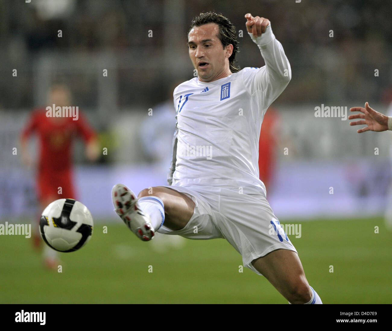 Greece's striker Theofanis Gekas volley-shoots the ball in the test cap Portugal v Greece at LTU Arena stadium in Duesseldorf, Germany, 26 March 2008. Greece defeated Portugal 2-1. Photo: Achim Scheidemann Stock Photo
