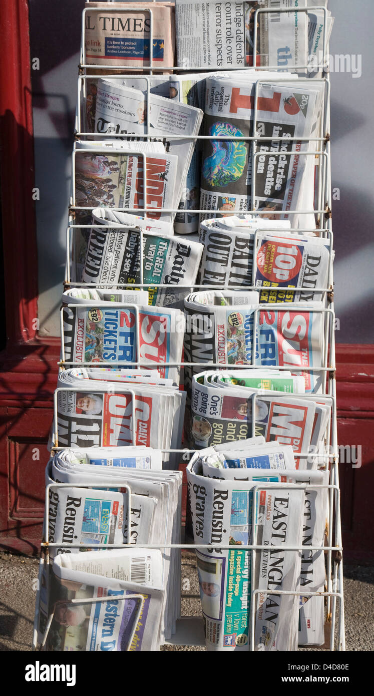 National newspapers displayed in rack stand, UK Stock Photo