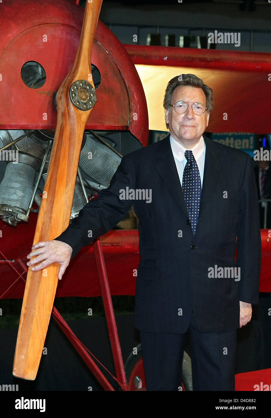 Manfred von Richthofen, President of the German Sport Federation (DSB) and nephew of the homonymous legendary airman, poses with a replica of the notorious fighter plane at the premiere of the film 'The Red Baron' in Berlin, Germany, 31 March 2008. The film on the story of WWI's most feared and recognized fighter pilot Manfred von Richthofen aka Red Baron is in German cinemas from  Stock Photo