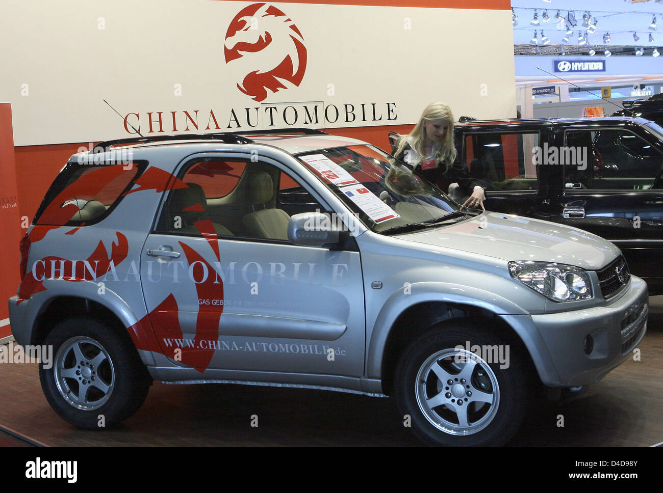 A Hostess Pictured With A Suv Of China Automobile At The Auto Mobil Stock Photo Alamy