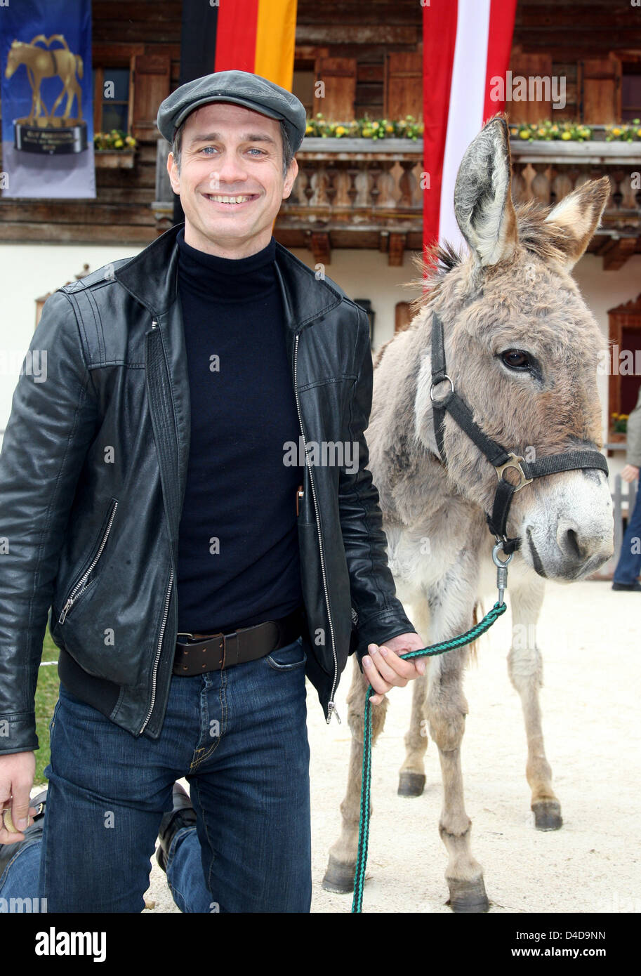 German actor Ralf Bauer poses with a donkey at animal sanctuary Gut ...