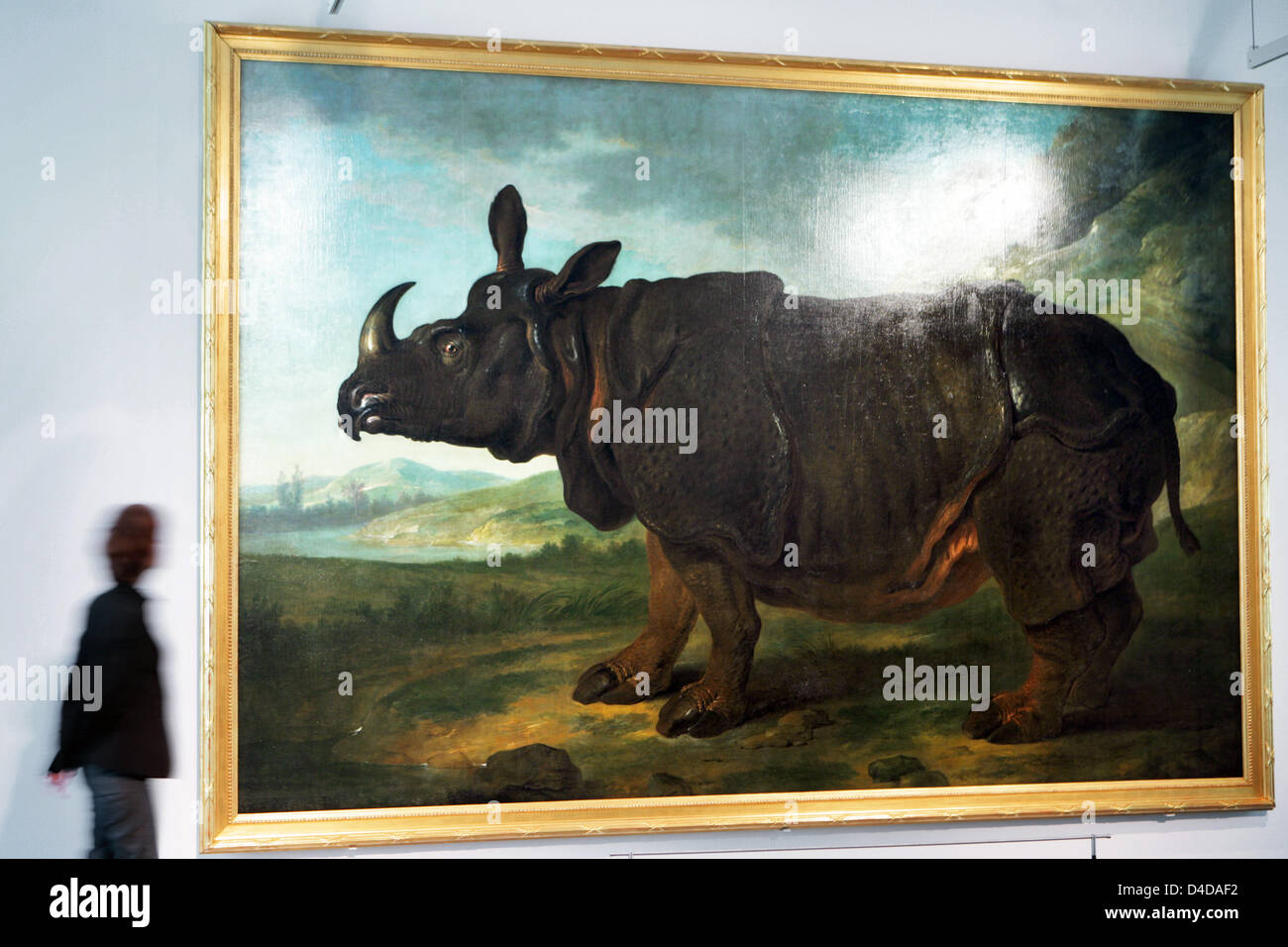 Staff of the Schwerin State Museum eyes the painting 'Rhinceros' by French court painter Jean-Baptiste Oudry (1686-1755) in Schwerin, Germany, 10 April 2008. The 3.10 by 4.56-metres oil-on-canvas painting was originally made for the botanical garden of King Louis XV of France and arrived at the residence of the Mecklenburg dukes in Ludwigslust, Germany in 1750 where it went straigh Stock Photo