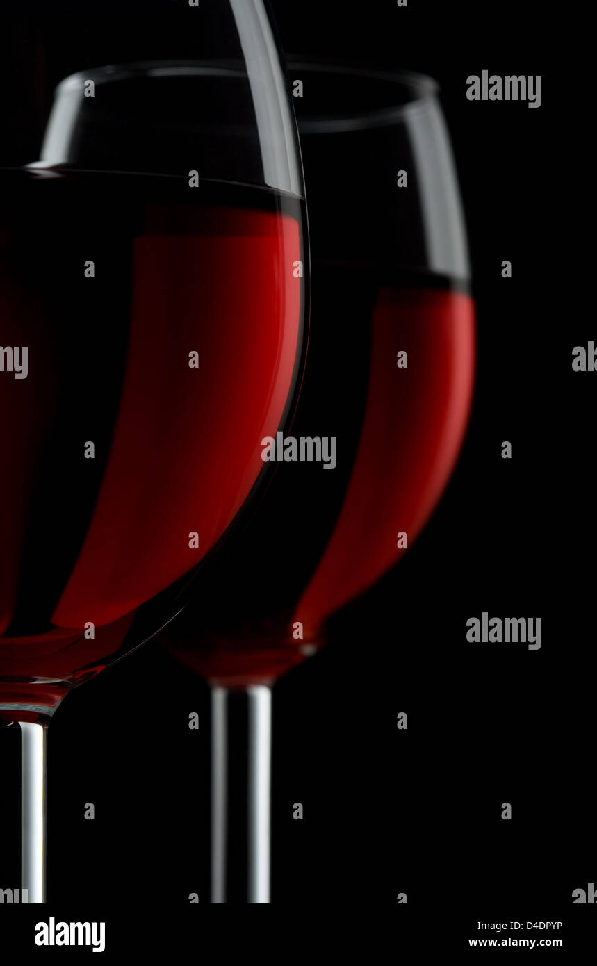 Two glassed of red wine isolated on black background Stock Photo