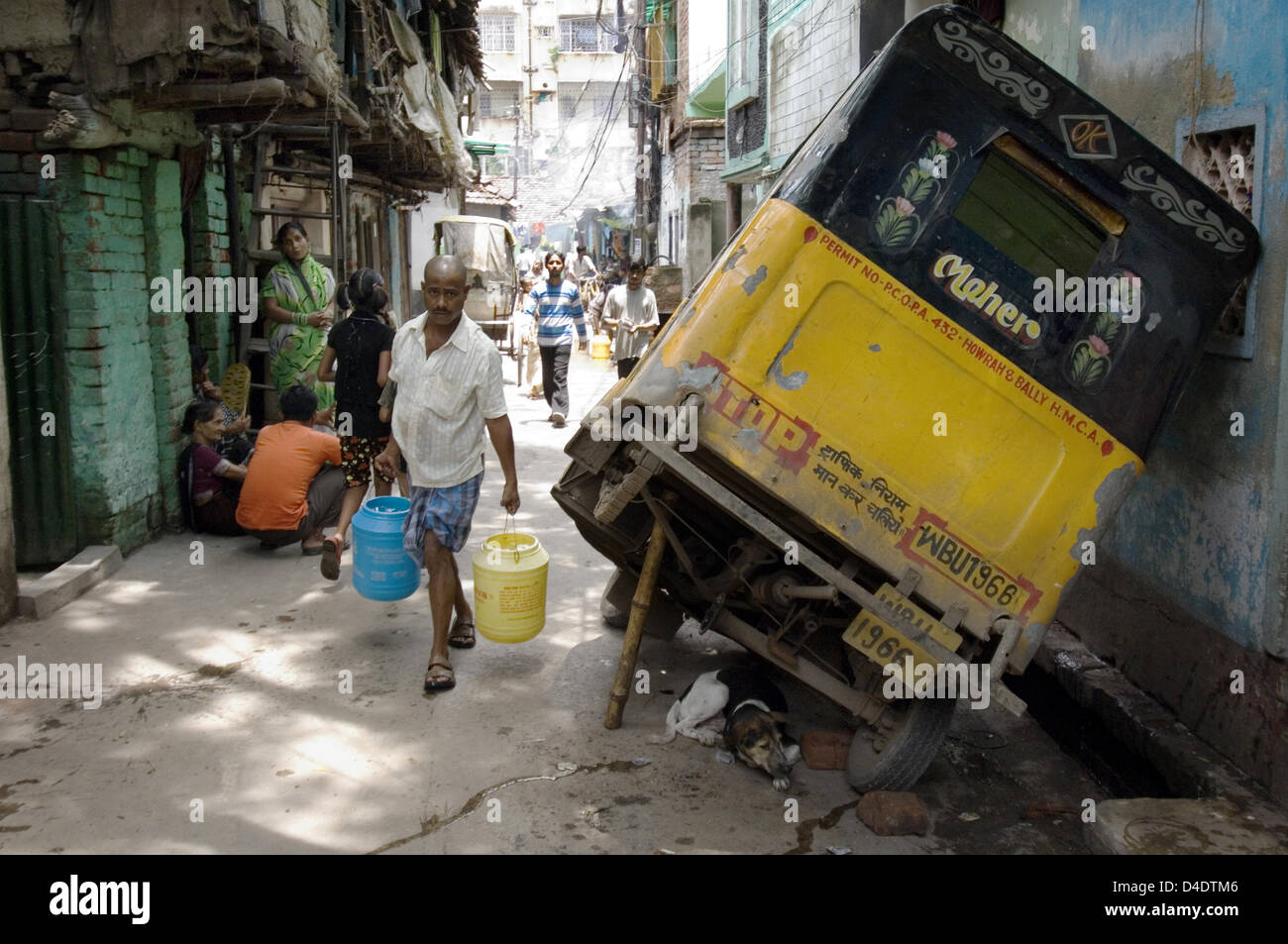 The picture shows a typical street scene in 'Busty', a poor neighbourhood in Howrah, India, August 2007. Photo: Denis Meyer Stock Photo