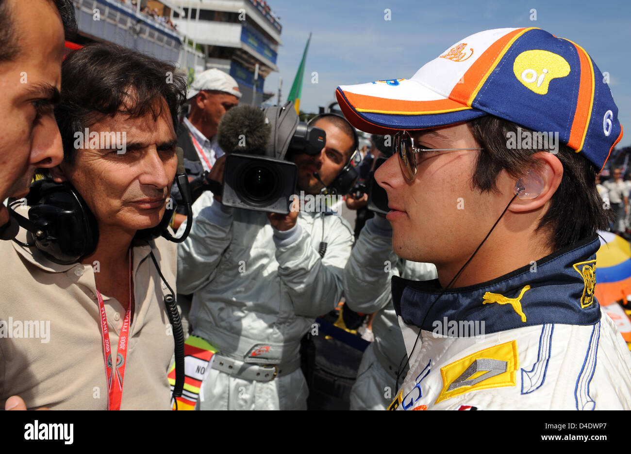 Brazilian Formula One driver Nelson Piquet Junior (R) of Renault talks to his father, former Formula One world champion Nelson Piquet Senior, before the start of the Formula 1 Grand Prix of Spain at Circuit de Catalunya in Montmelo near Barcelona, Spain, 27 April 2008. Photo: GERO BRELOER Stock Photo