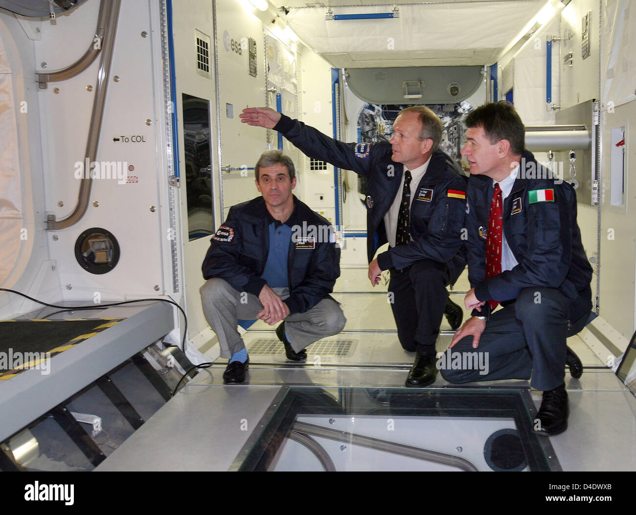 Astronauts of the European Space Agency ESA (L-R) Leopold Eyharts of France, Hans Schlegel of Germany and Paolo Nespoli of Italy pose inside a model of the Columbus laboratory in Cologne, Germany, 29 April 2008. ESA and the German Aerospace Centre (DLR) currently campaign for the next generation of astronauts. Photo: OLIVER BERG Stock Photo