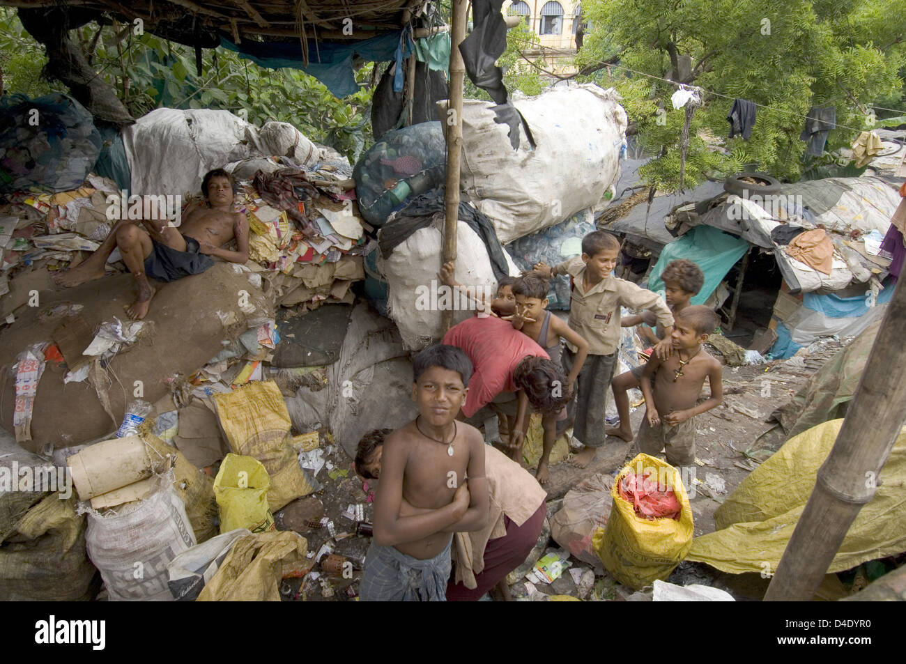 (dpa file) The file picture dated July/August 2007 shows slum dwellers making their living from collecting garbage to be resold for recycling in Howrah, India. Photo: Denis Meyer Stock Photo