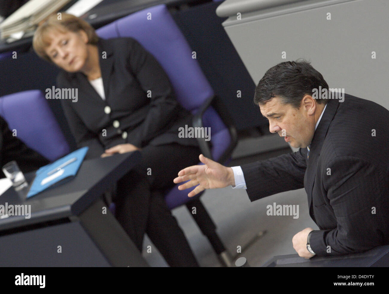 German Chancellor Angela Merkel listens attentively to a speech delivered by Environment Minister Sigmar Gabriel at the Bundestag in Berlin, Germany, 08 May 2008. The Bundestag debates on the extinction of vital plant and animal species in view of the nature protection conference to be held mid-month in Bonn. Photo: RAINER JENSEN Stock Photo