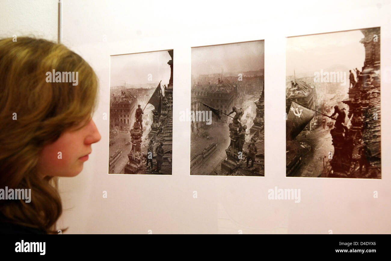 Three famous pictures of Russian photographer Yevgeny Khaldei show a Russian soldier placing the Soviet Union's Red flag atop the Reichstag building in Berlin on 02 May 1945, presented at an exhibition at Martin-Gropius building in Berlin, Germany, 08 May 2008. It is part of the retrospective on Khaldei, 'The Important Instant', which runs from 09 May until 28 July. Photo: STEPHANI Stock Photo