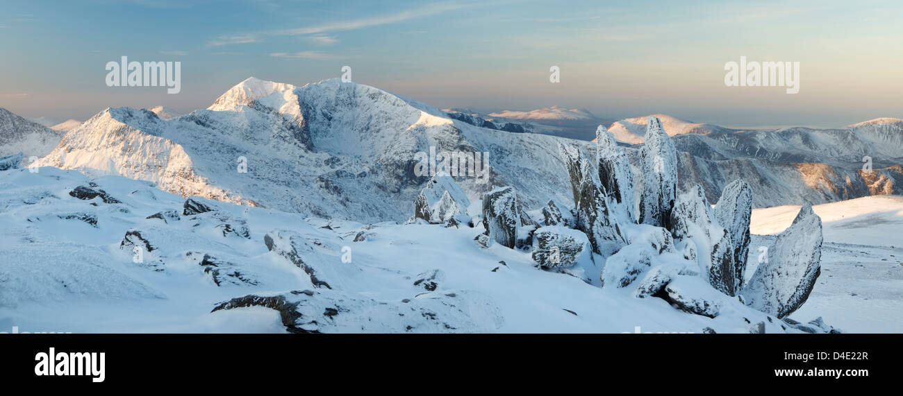 Panoramic Snowy Sunrise of Snowdon, taken from Glyder Fach on the Glyderau Stock Photo