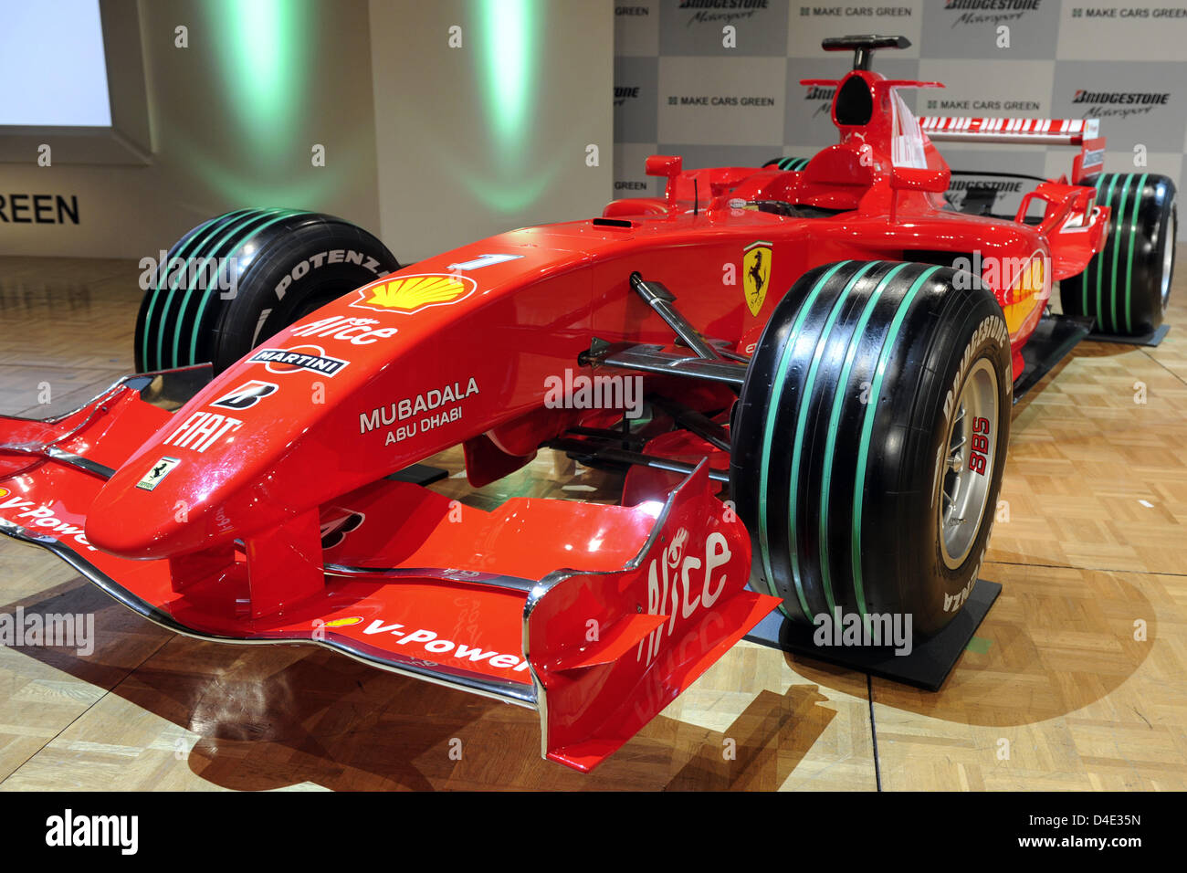 A Scuderia Ferrari racing car is equipped with special green-marked ...