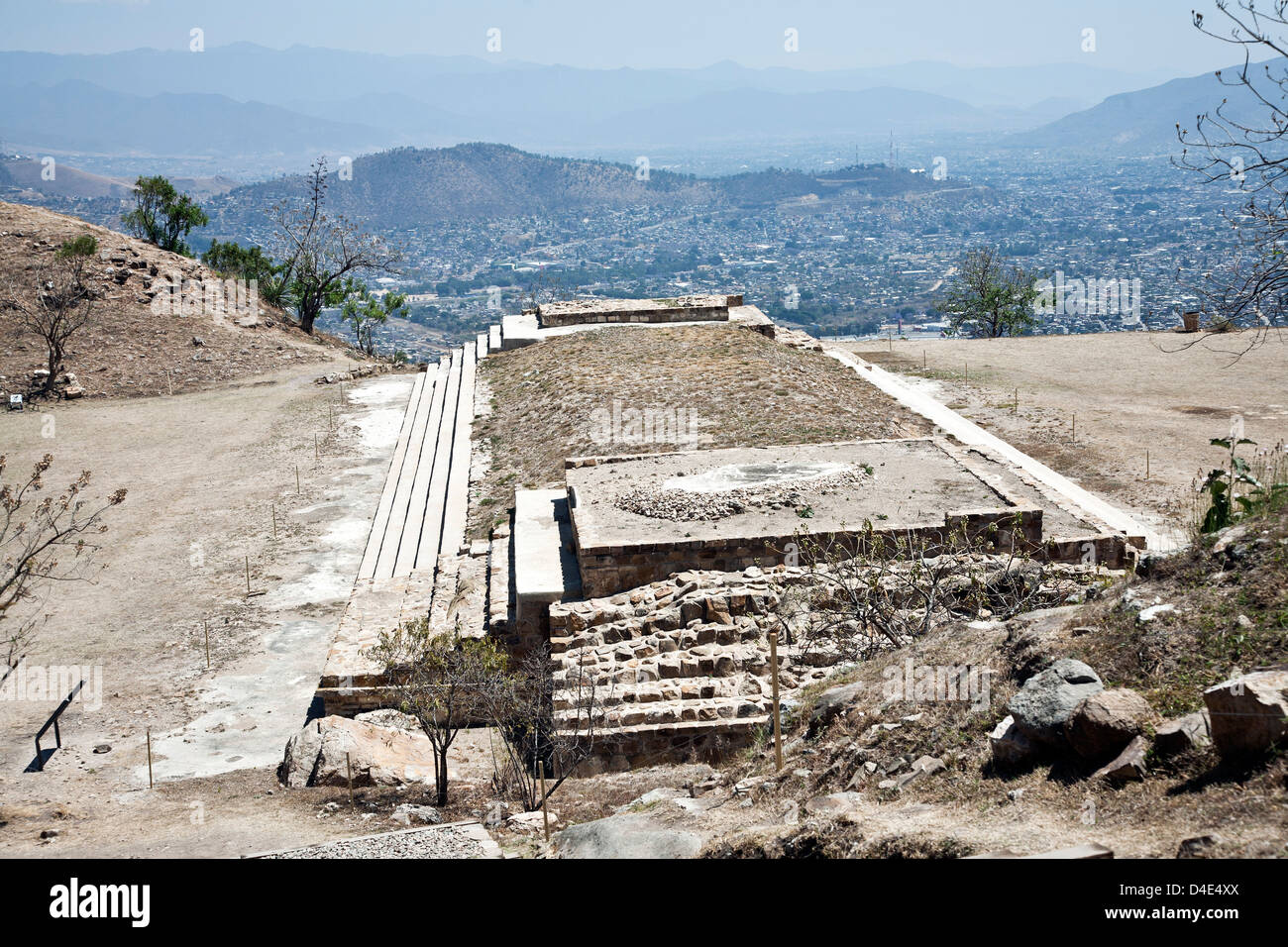 view looking down on long Building 8 at south side of mid level Plaza B in restored recently opened pre Columbian Atzompa ruins Stock Photo