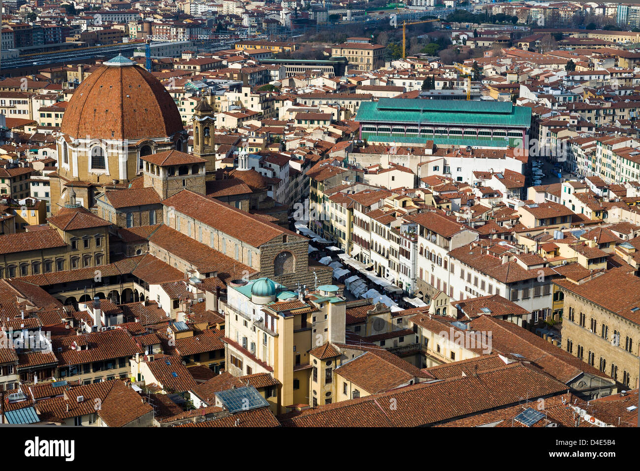 The rooftops of Florence, Italy, from the Duomo. The green roof of the Mercato Centrale and the Basilica di San Lorenzo. Stock Photo