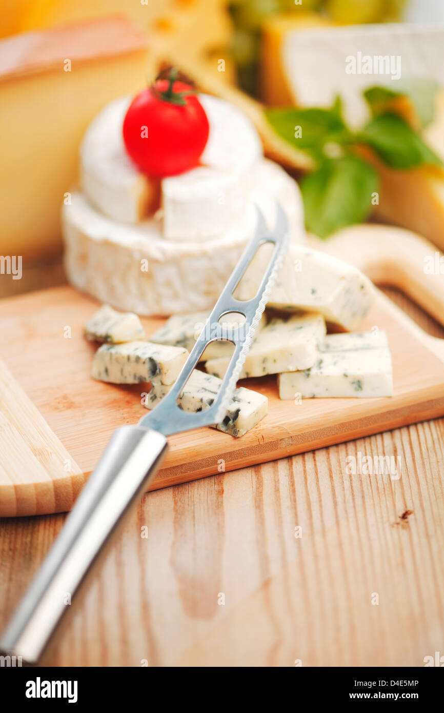 cheese with a cheese knife Stock Photo Alamy