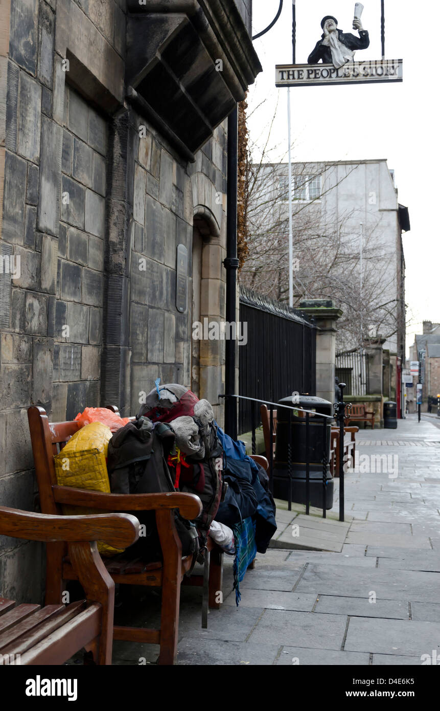 Downandout (tramp) sleeping on a bench in the Royal Mile in Edinburgh