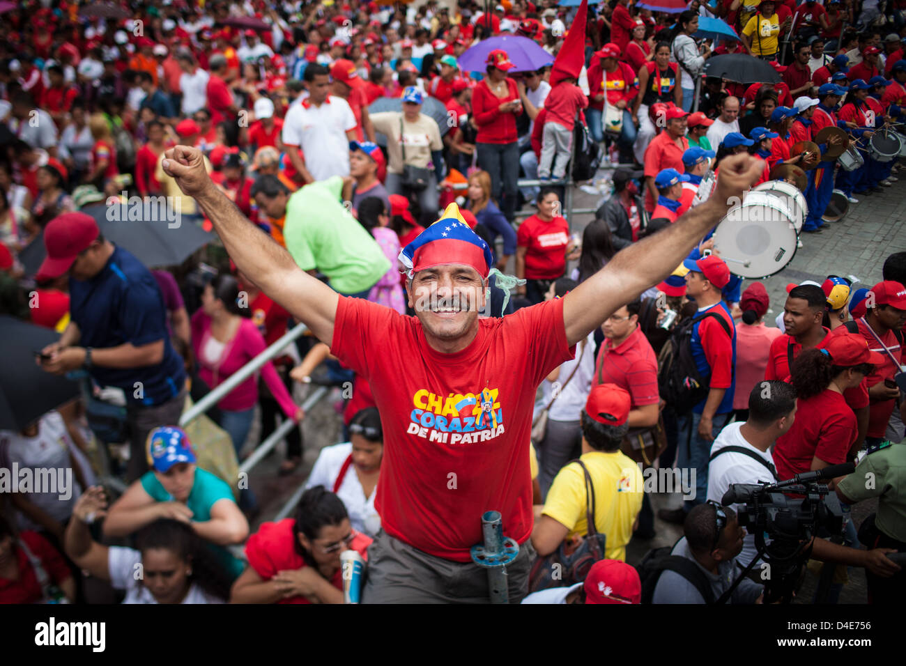 A man smiles slogans during a rally in support of acting President Nicolas Maduro in Venezuela Stock Photo