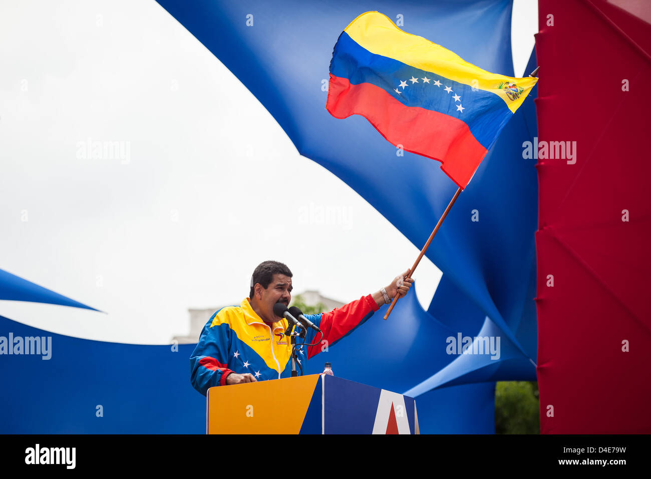 Venezuelan President in Charge Nicolas Maduro waves a national flag during the official registration of his candidacy Stock Photo