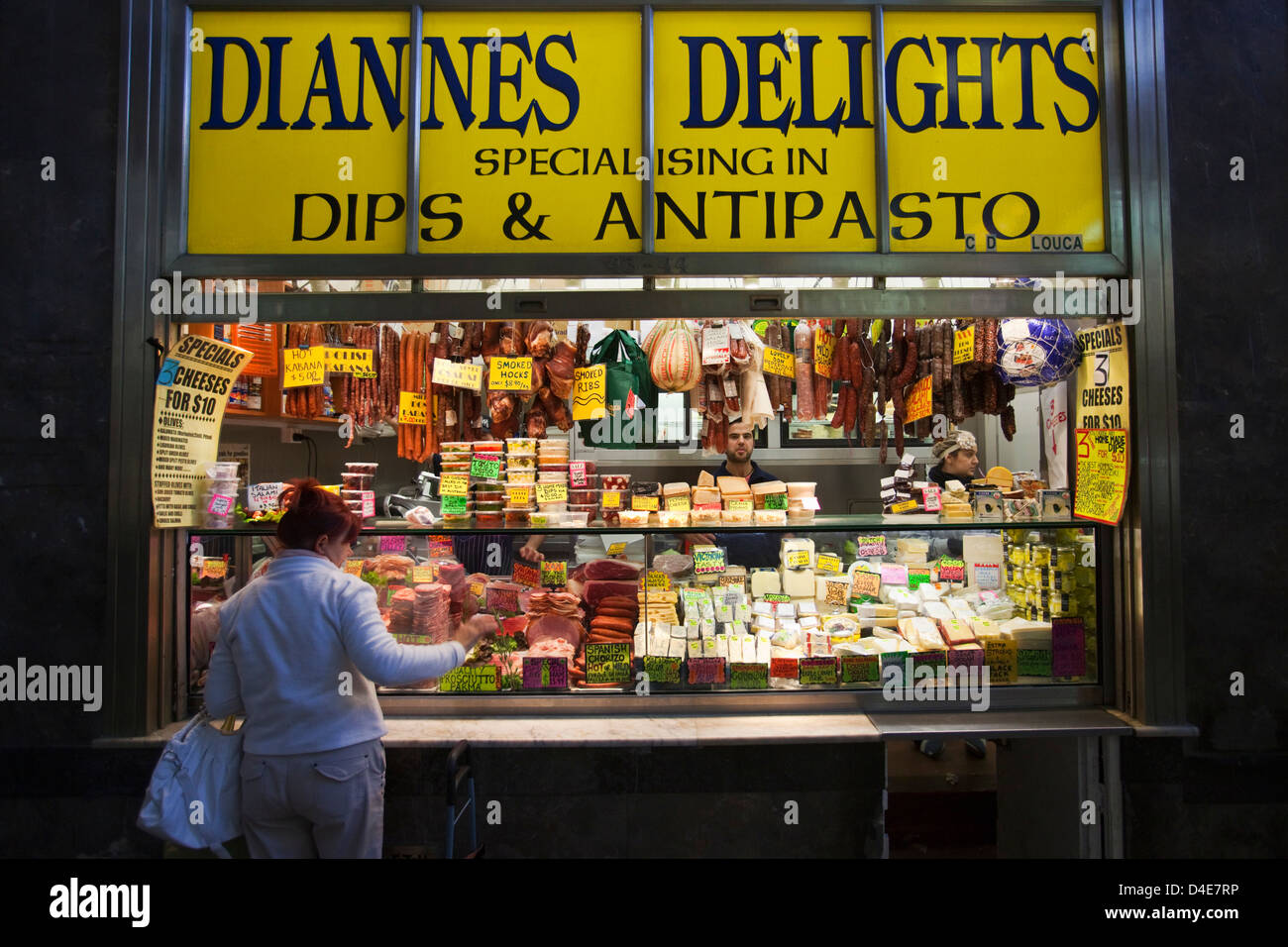 Woman shopping at Delicatessen in the Queen Victoria Market. Melbourne, Victoria, Australia Stock Photo