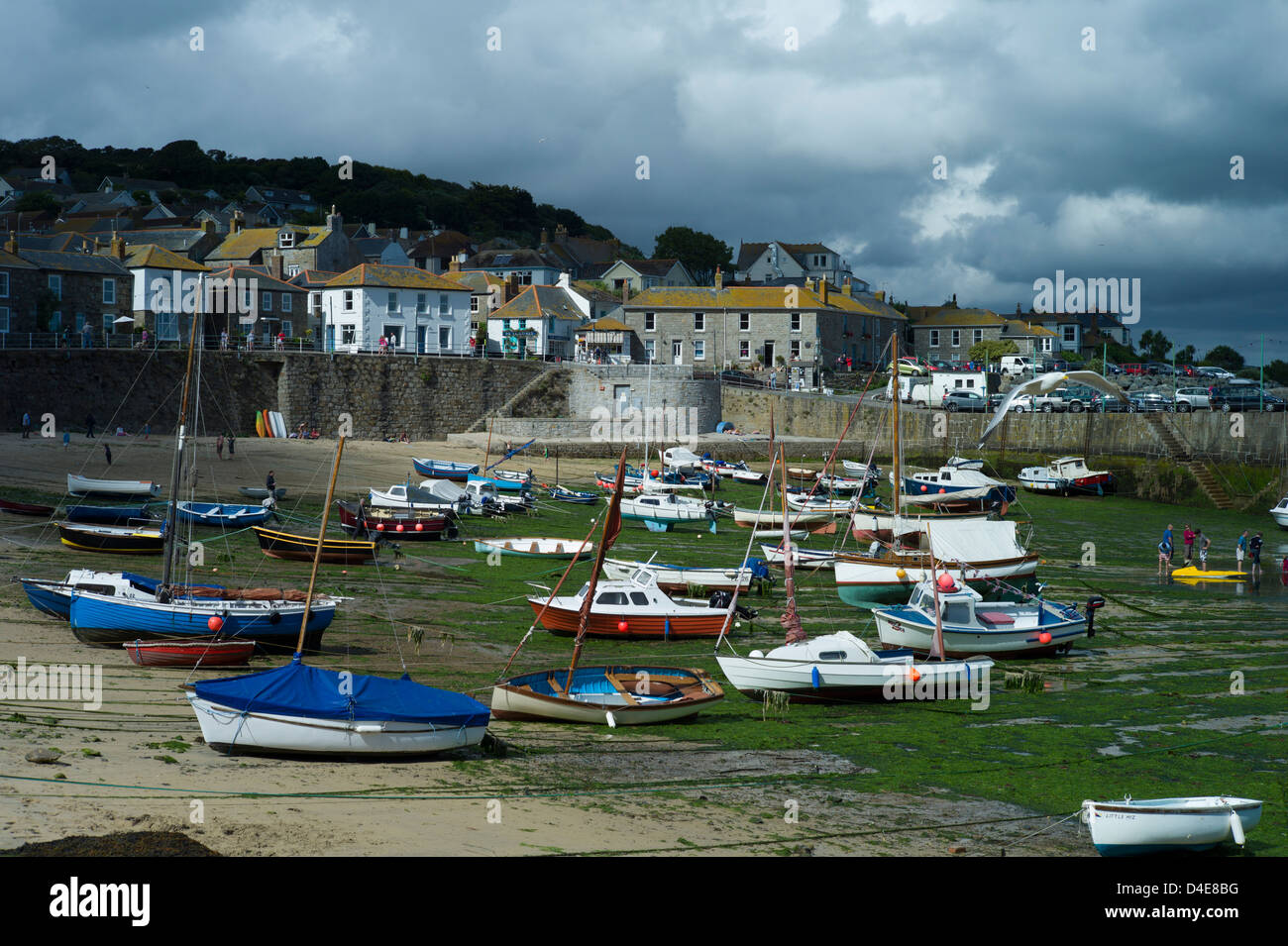 Cornish fishing village, Mousehole, Cornwall, England,August 2011. Fishing and pleasure boats wait for the tide at Mousehole. Stock Photo