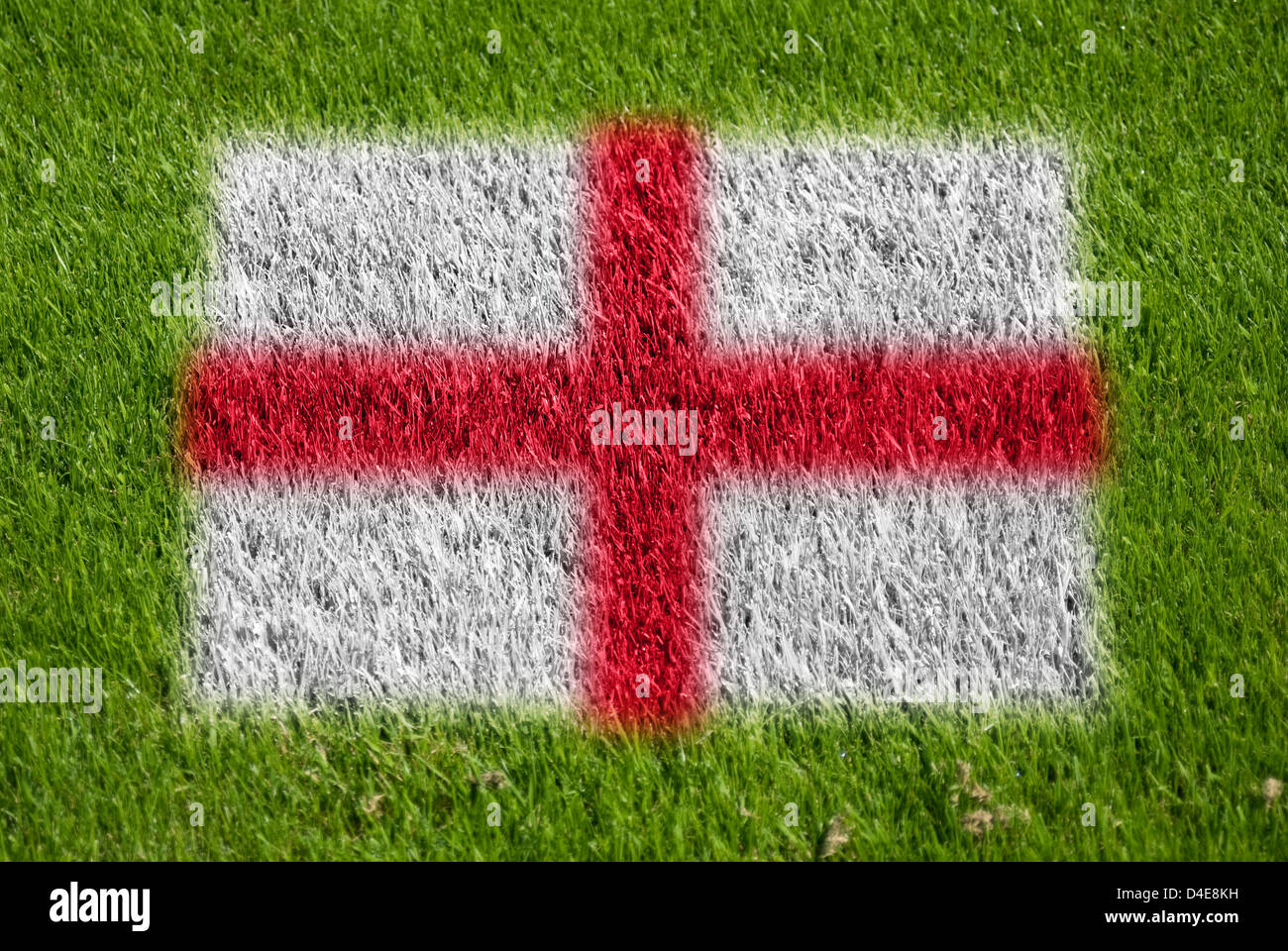 flag of england on grass with spray Stock Photo