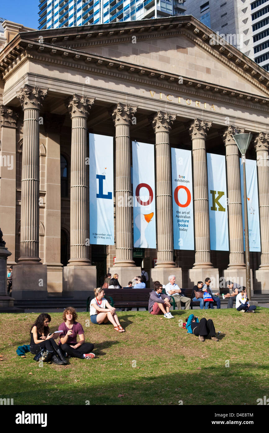 People relaxing outside the State Library of Victoria. Melbourne, Victoria, Australia Stock Photo