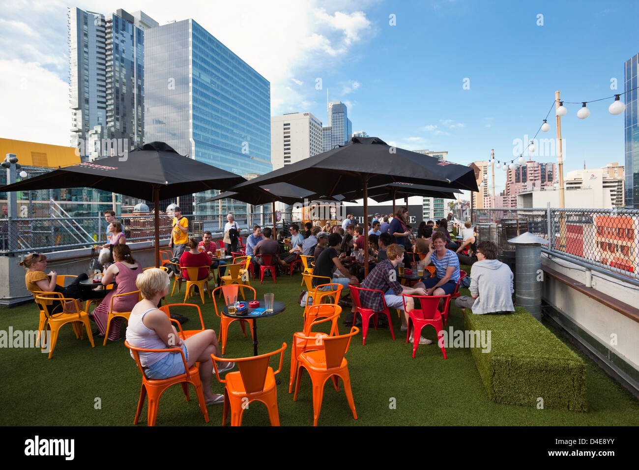 People Relaxing At Rooftop Bar At Curtain House Melbourne