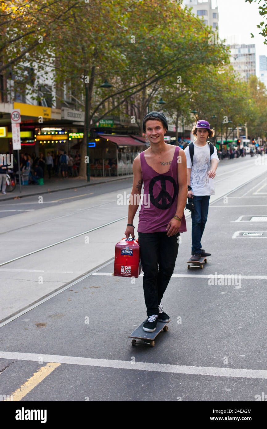 Youths skateboarding along Swanston Street. Melbourne, Victoria, Australia Stock Photo