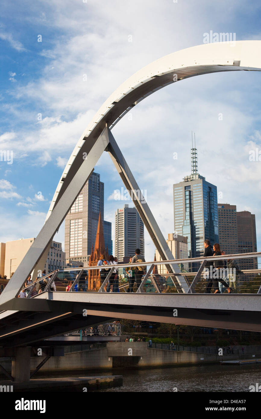 People crossing Southgate Bridge with city skyline in background. Melbourne, Victoria, Australia Stock Photo