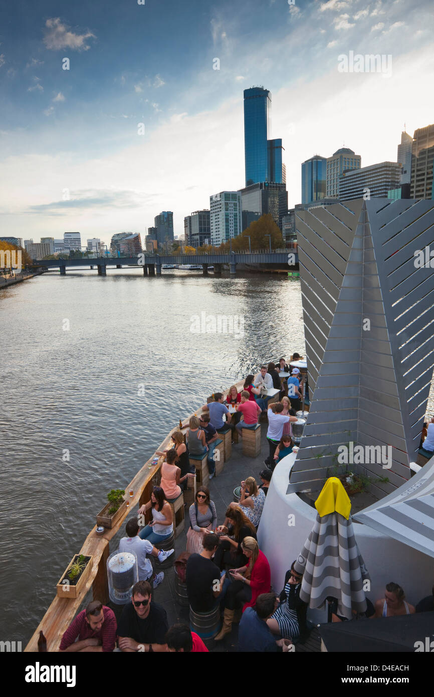 People drinking at Ponyfish Island, on the Yarra River. Melbourne, Victoria, Australia Stock Photo