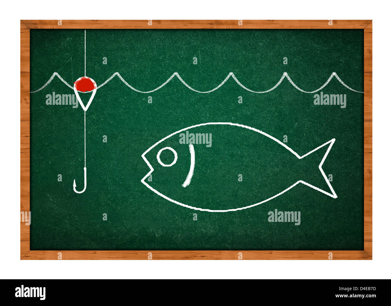 Simple drawing of a fish on a green chalkboard background. Stock Photo
