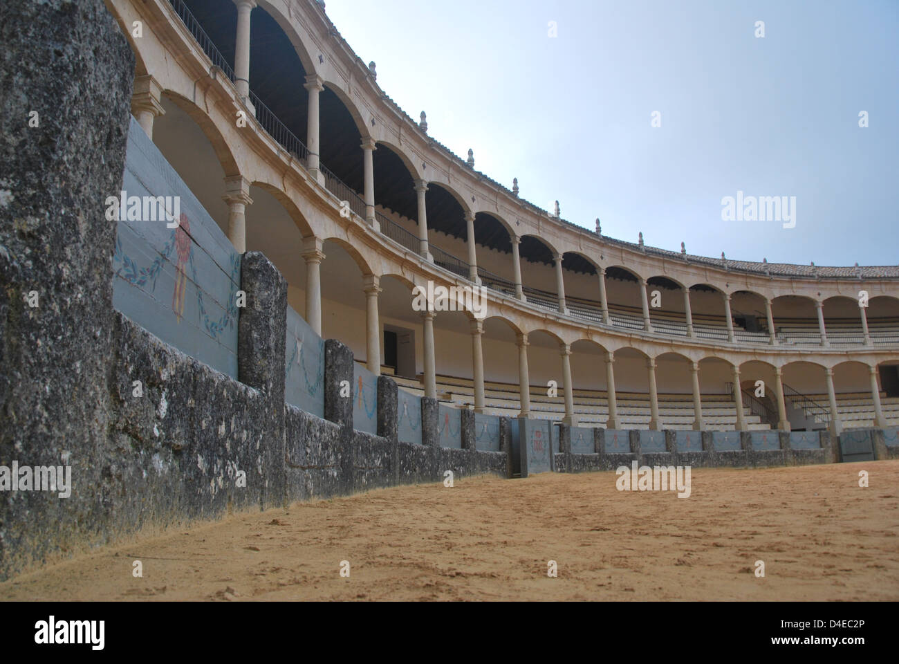 The arches of the Plaza de Toros in Ronda, Spain in late afternoon light . Stock Photo