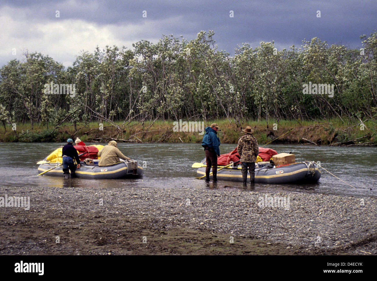 Fishermen loading their rafts on a fly fishing float trip to Alaska