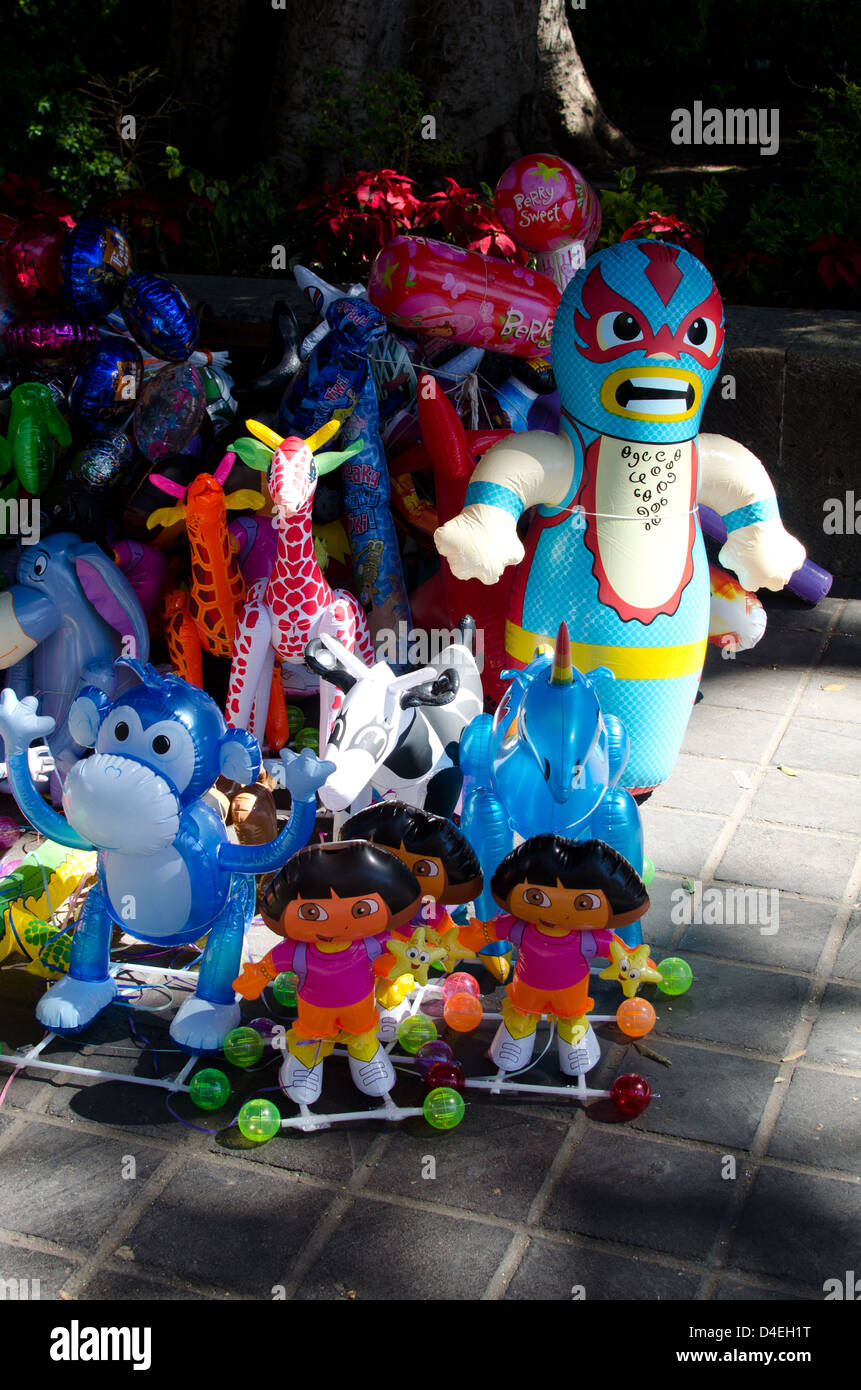 A street vendor's inflatable wares in the Zocalo, Oaxaca, Mexico. Stock Photo
