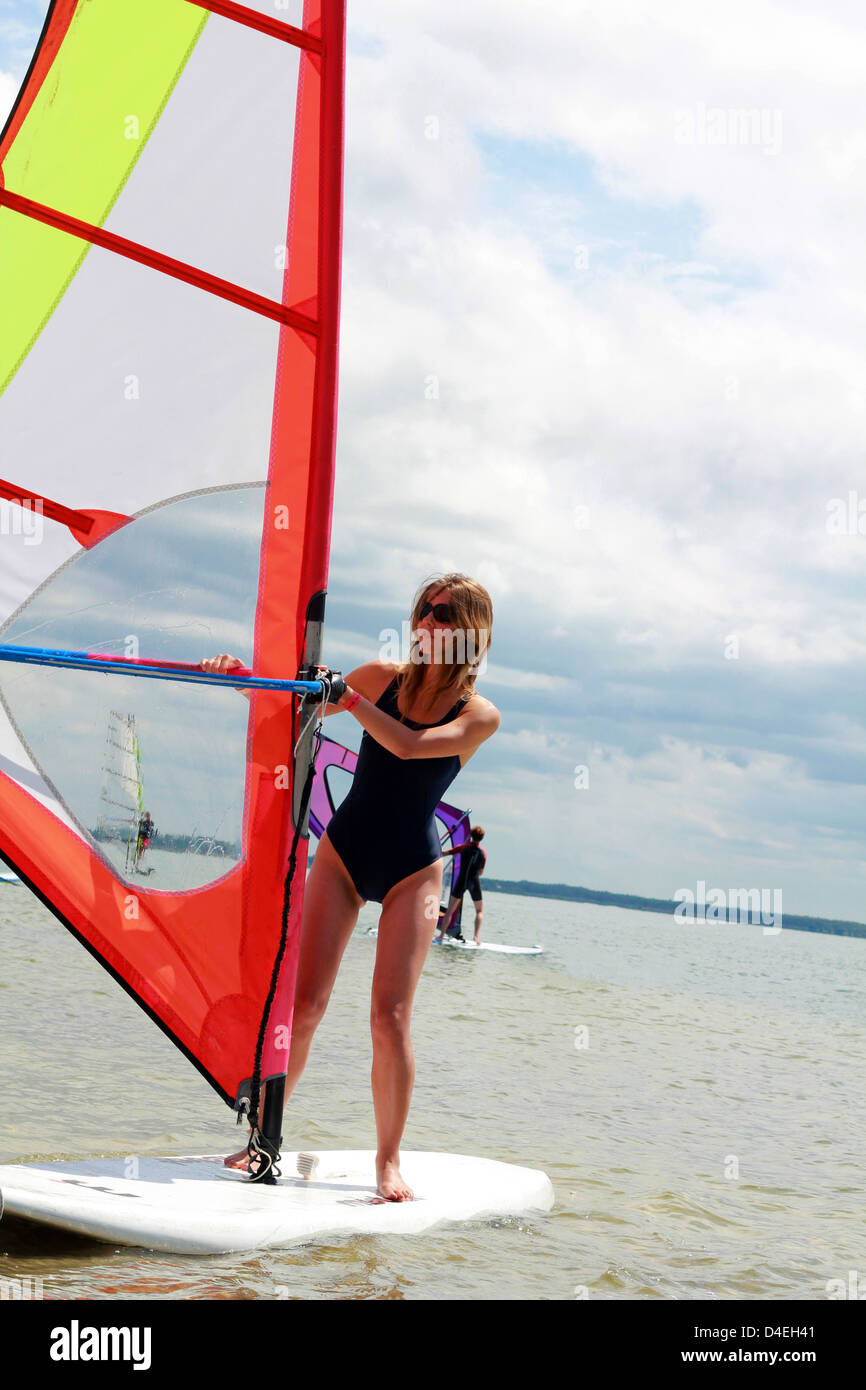 Young woman windsurfing on the Lacanau lake, France Stock Photo Alamy