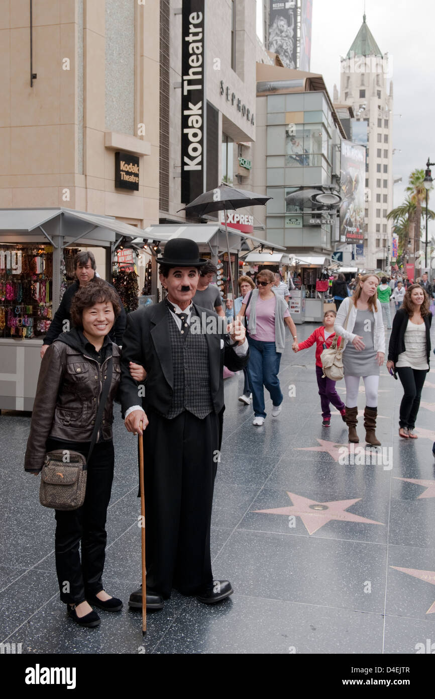 Los Angeles, USA, a tourist with a Charlie Chaplin double on Walk of Fame Stock Photo