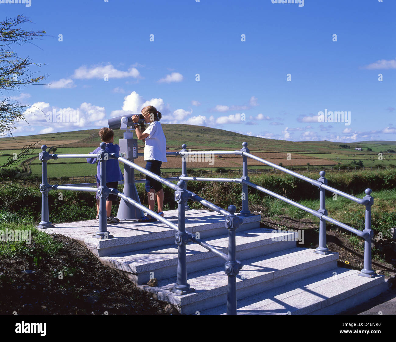 Children using observation telescope at Bodmin Moor lookout, Bodmin Moor, Altarnun, Cornwall, England, United Kingdom Stock Photo