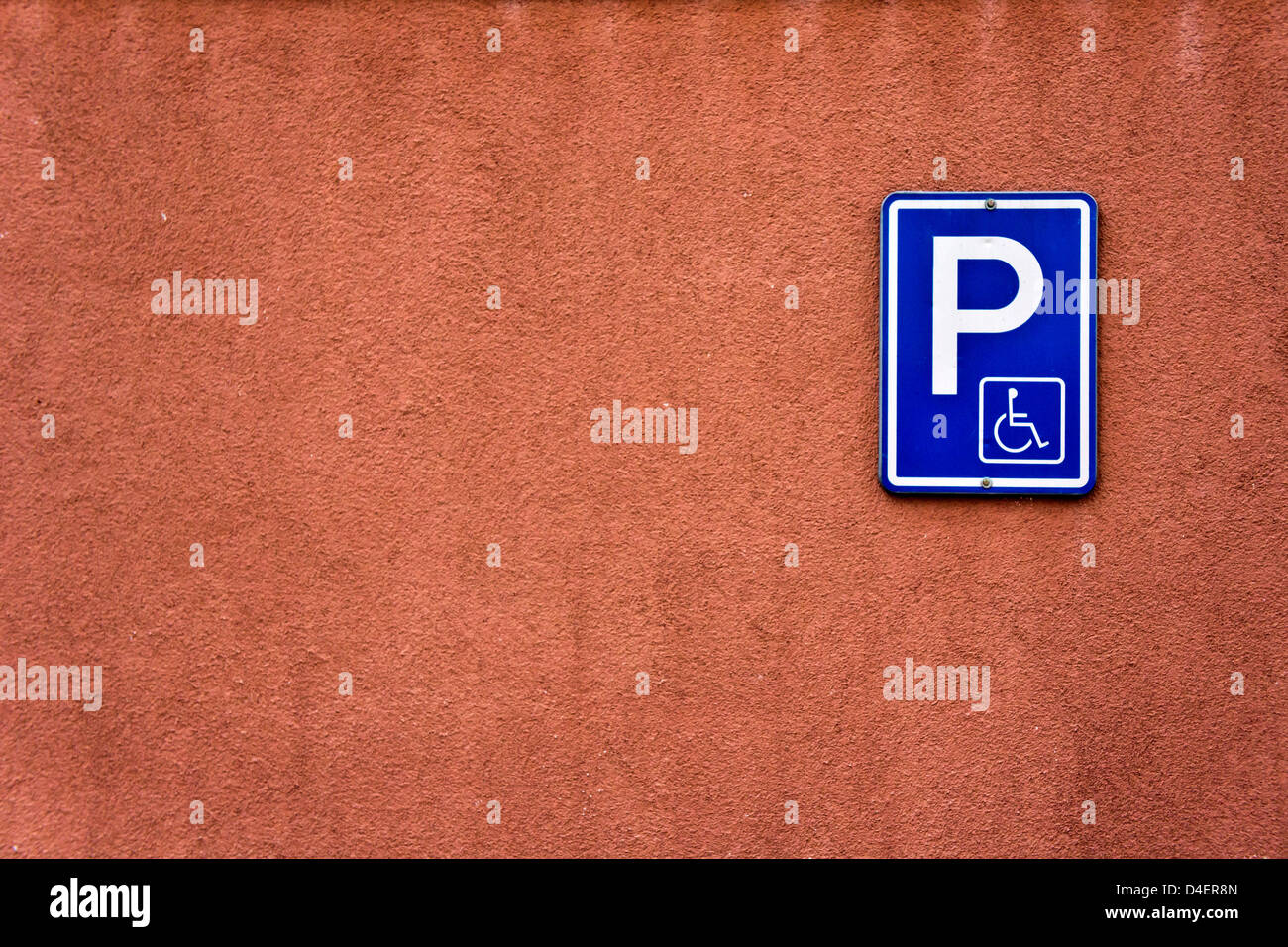disabled parking sign on a wall Stock Photo - Alamy