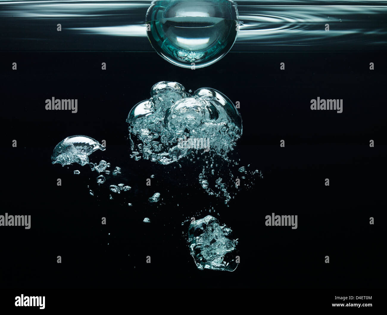 Bubbles floating underwater Stock Photo