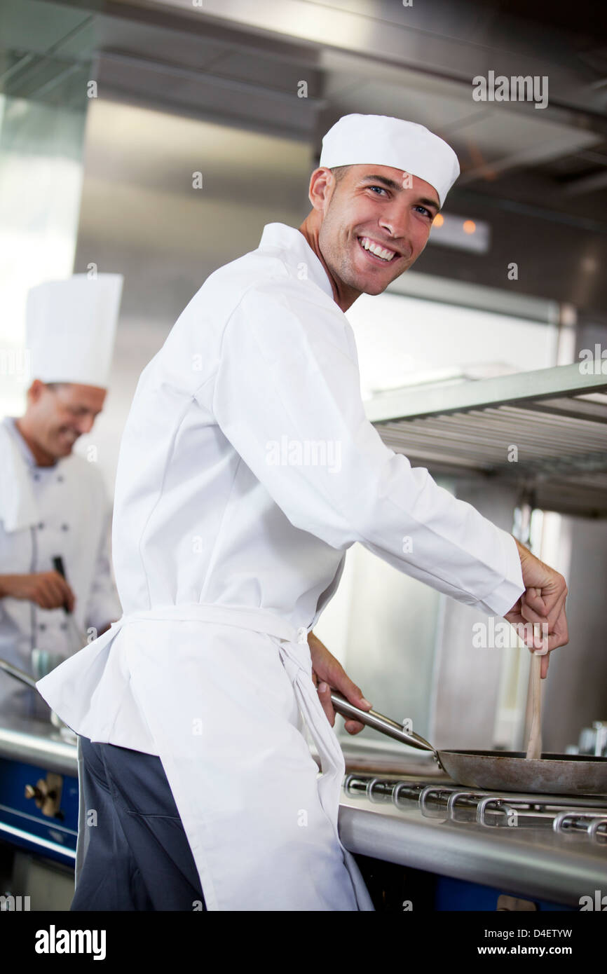 Chef cooking in restaurant kitchen Stock Photo