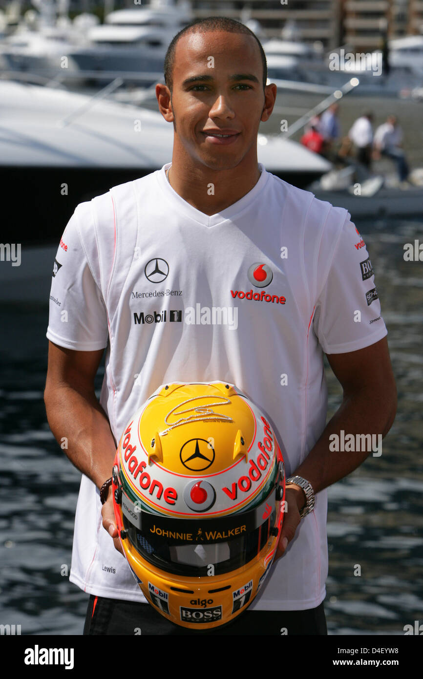 British Formula One driver Lewis Hamilton of Team McLaren Mercedes presents  his Steinmetz-diamonded helmet prior