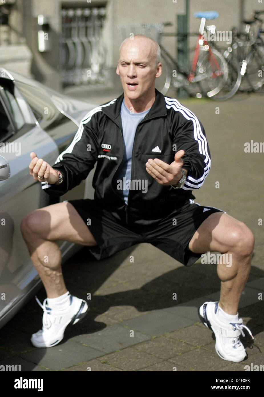 Fitness instructor David Kirsch is pictured during a workout next to a car in Cologne, Germany, 02 June 2008. The car manufacturer 'Audi' invited 50 women to spent a day with Kirsch. Kirsch will give advice on how to stay in good shape and keep a healthy diet. The former lawyer is a successful personal trainer for models and Hollywood actors in the USA. Photo: Joerg Carstensen Stock Photo