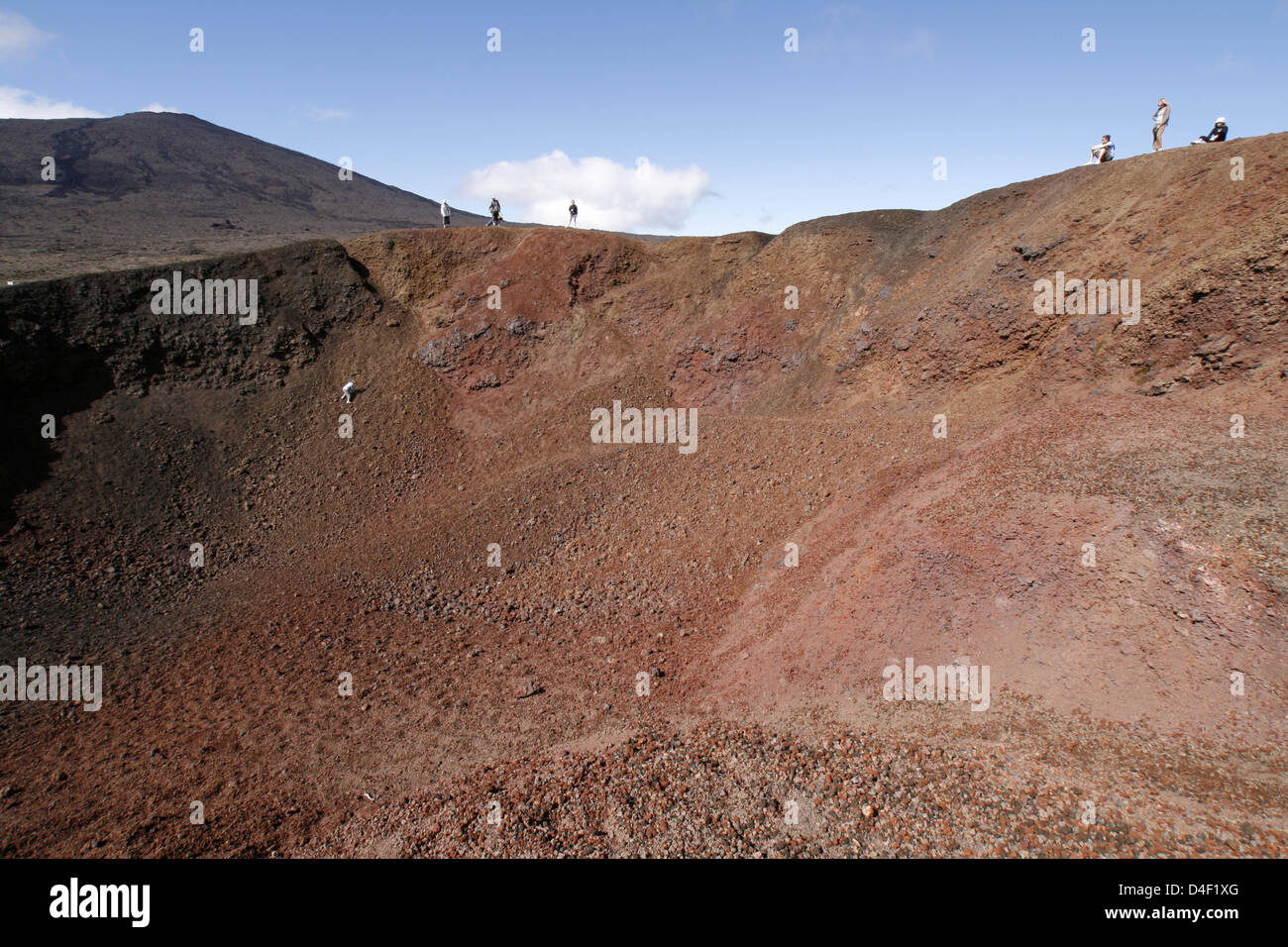 Tourists stand around at the Formica Leo's crater rib on Indian Ocean ...