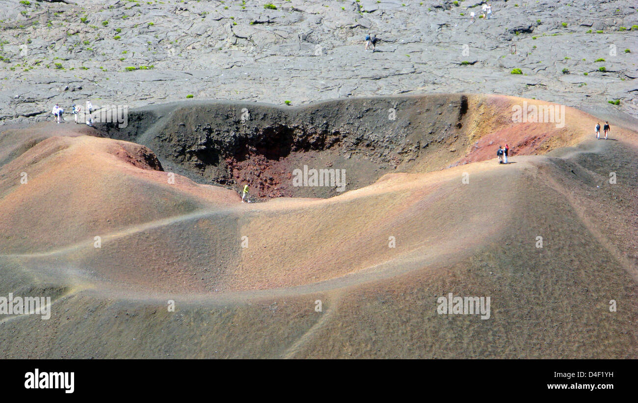 Tourists stand around rib of crater Formica Leo on Indian Ocean island ...