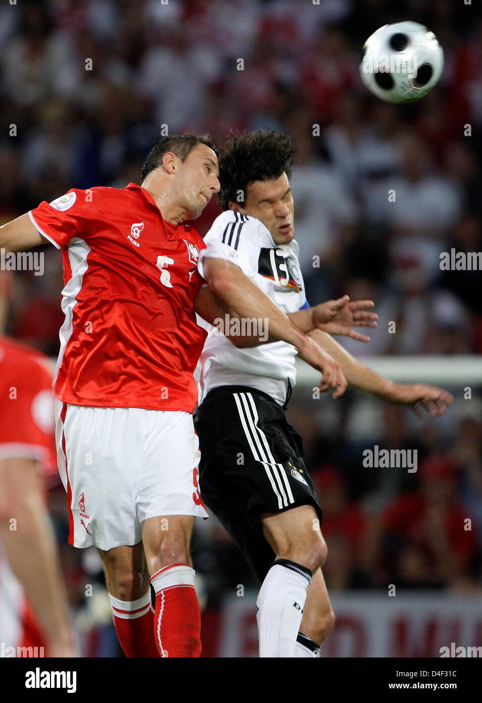 Miachel Ballack (r) of Germany vies with Dariusz Dudka of Poland during the EURO 2008 preliminary round group B match in Woerthersee Stadium, Klagenfurt, Austria, 08 June 2008. Photo: Oliver Berg dpa +please note UEFA restrictions particularly in regard to slide shows and 'No Mobile Services'+ +++(c) dpa - Bildfunk+++ Stock Photo