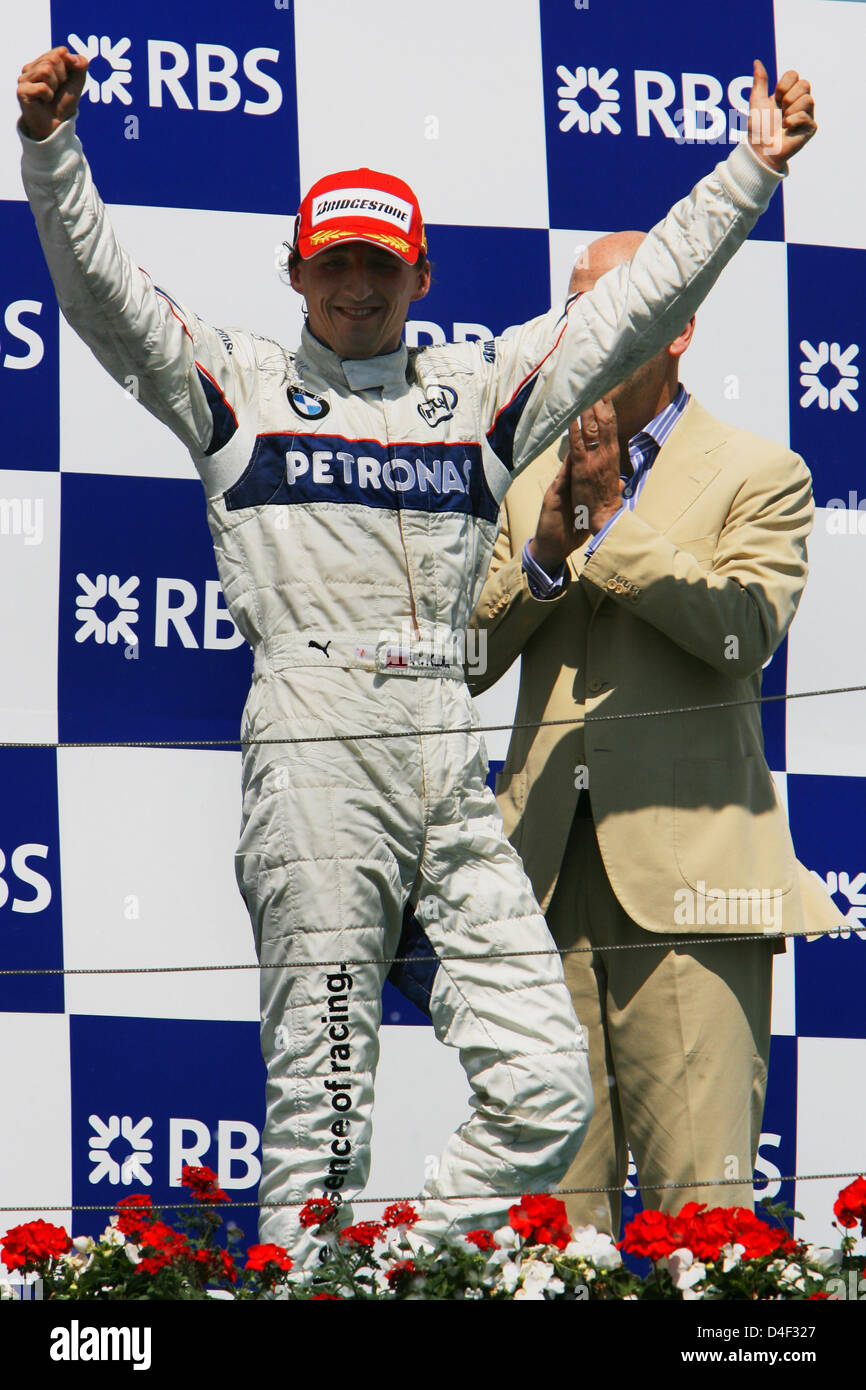 Polish Formula One driver Robert Kubica of BMW Sauber celebrates on the