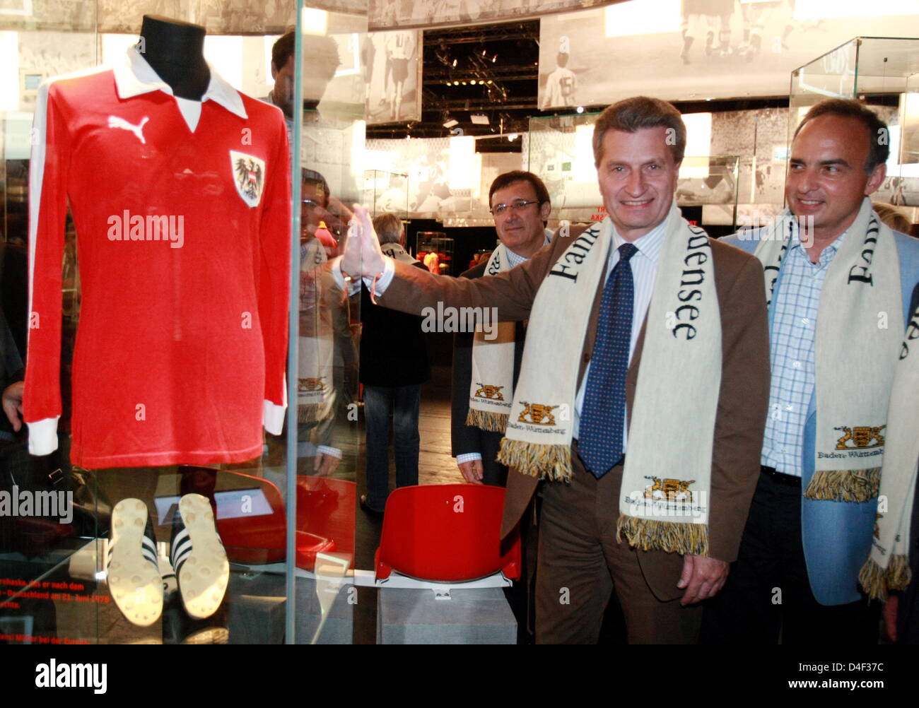 Prime Minister of the state of Baden-Wuerttemberg Guenther Oettinger (L) and former German international football player Hansi Mueller (R) are pictured with Mueller's original jersey at the exhibition 'Das Wunder von Bregenz' (The miracle of Bregenz) in Bregenz, Austria, 07 June 2008. From 7 till 29 June 2008 the 'Haus der Geschichte Baden-Wuerttemberg' presents an impression of Ge Stock Photo