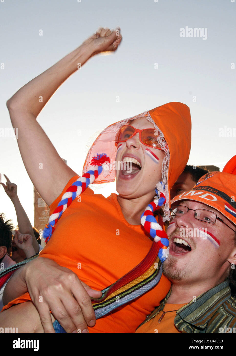 Two Dutch fans are merry over their squad's 1-0 lead in the UEFA EURO ...