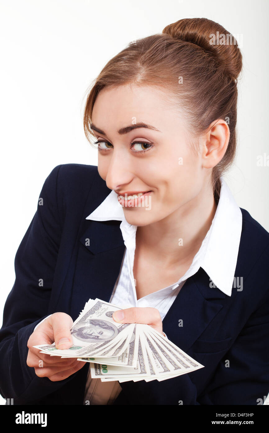 Portrait of excited young woman holding money in the hand on white ...