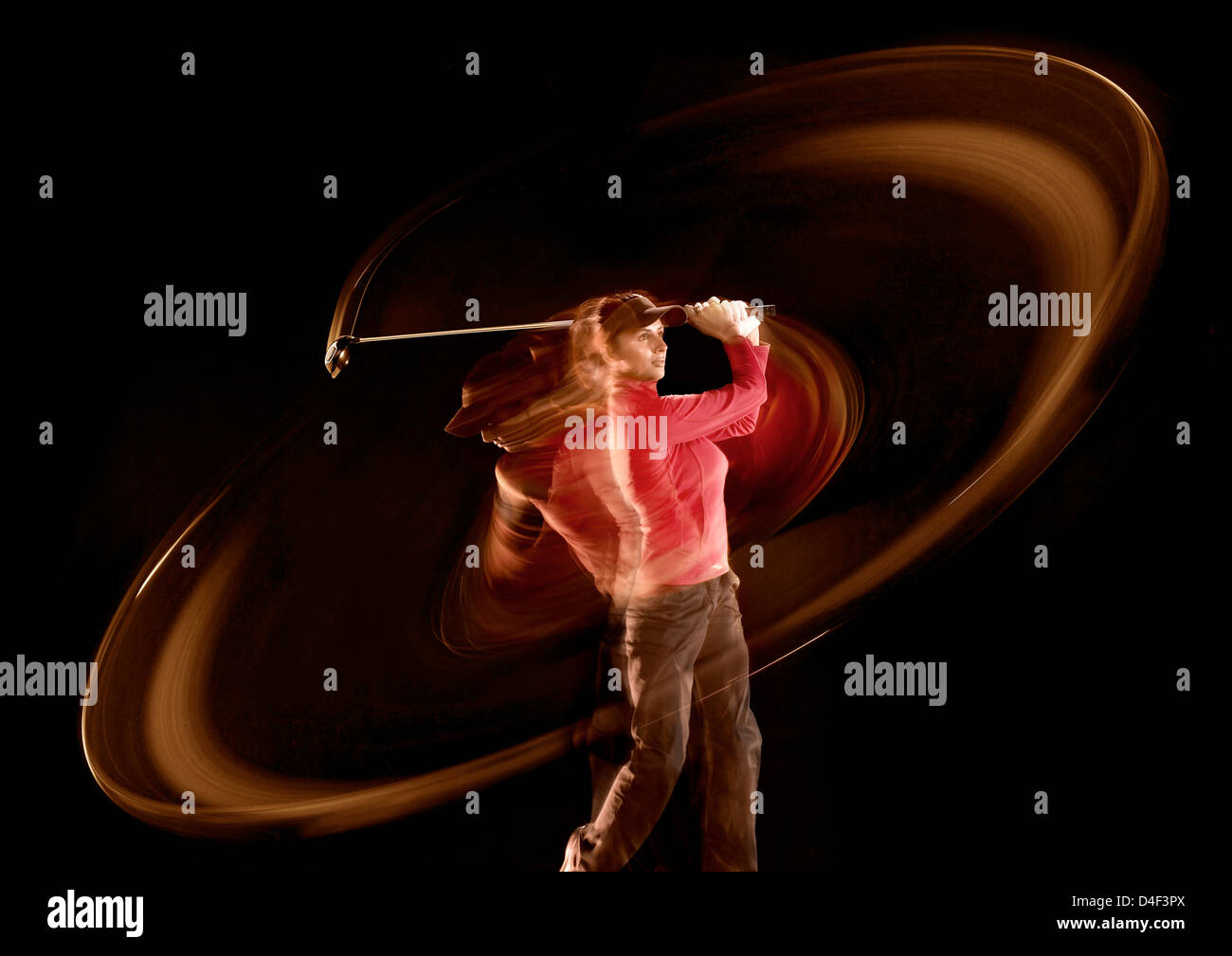 Time lapse view of golfer swinging Stock Photo
